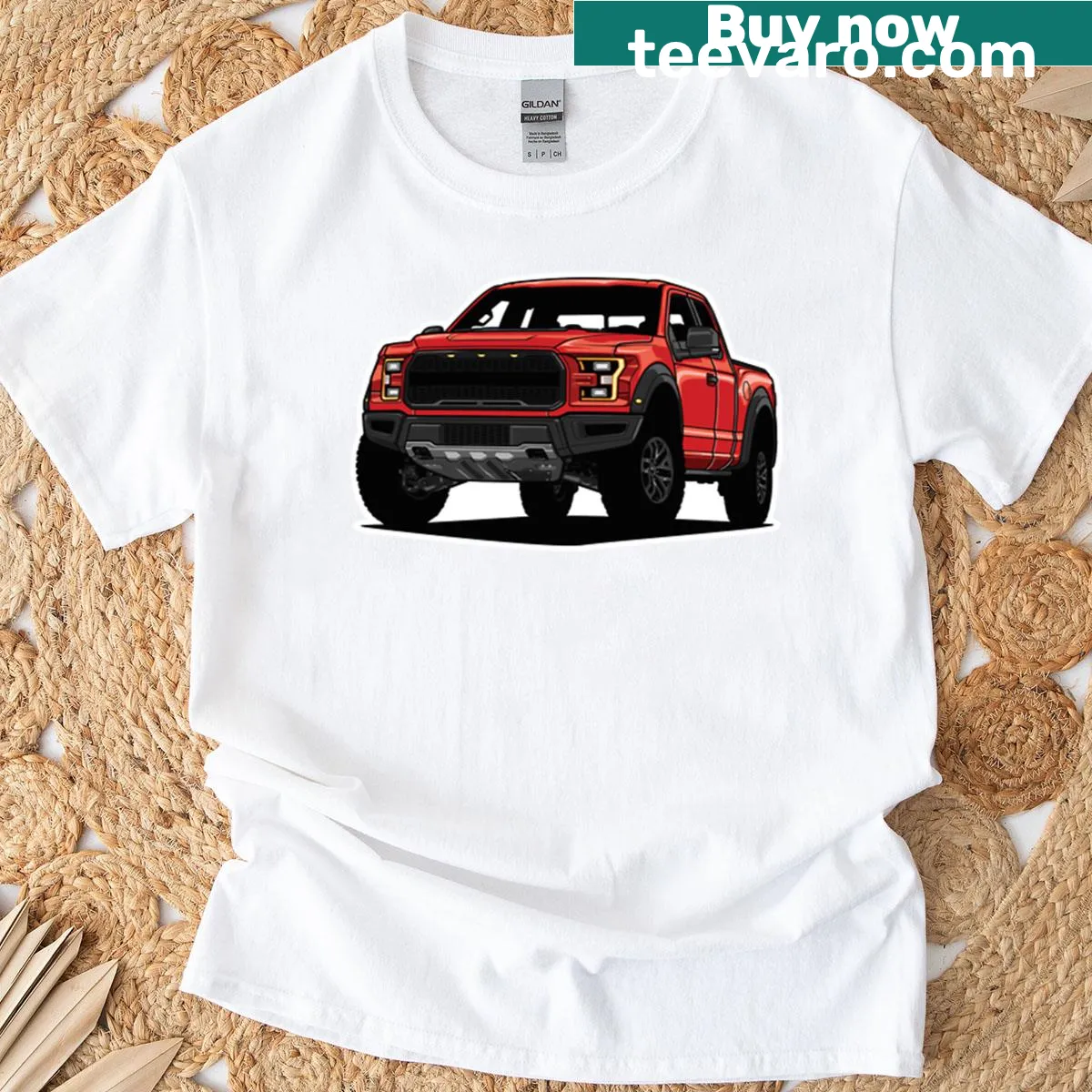 T-shirt featuring a dinosaur driving an off-road pickup truck graphic — on a men's t-shirt