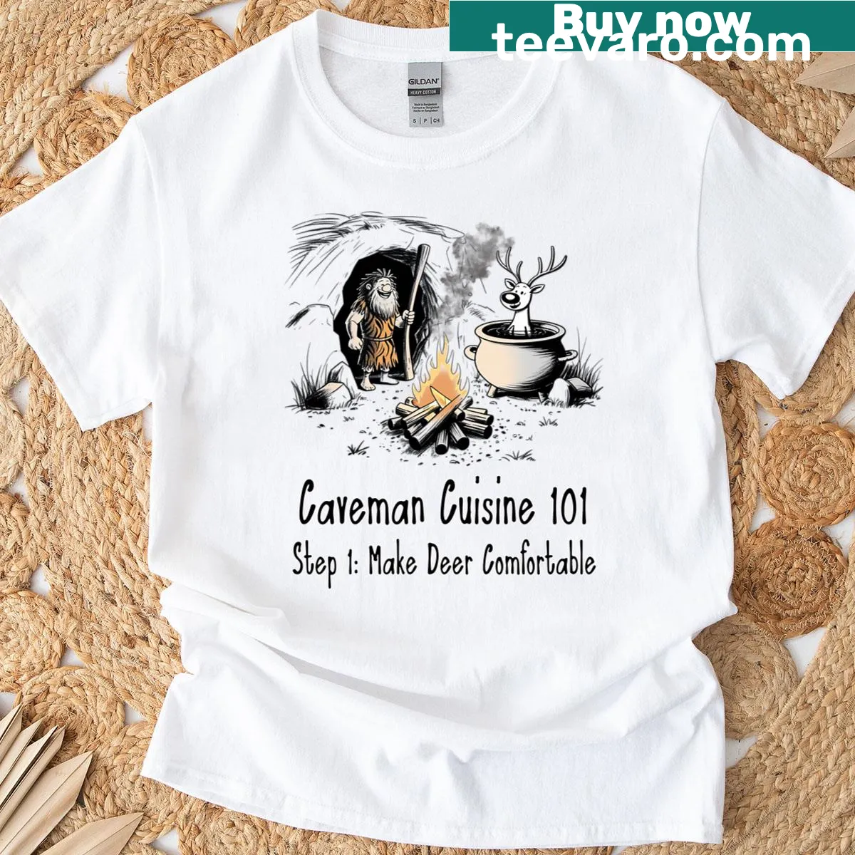 Cartoon T-shirt depicting cavemen and prehistoric cooking — on a men's t-shirt