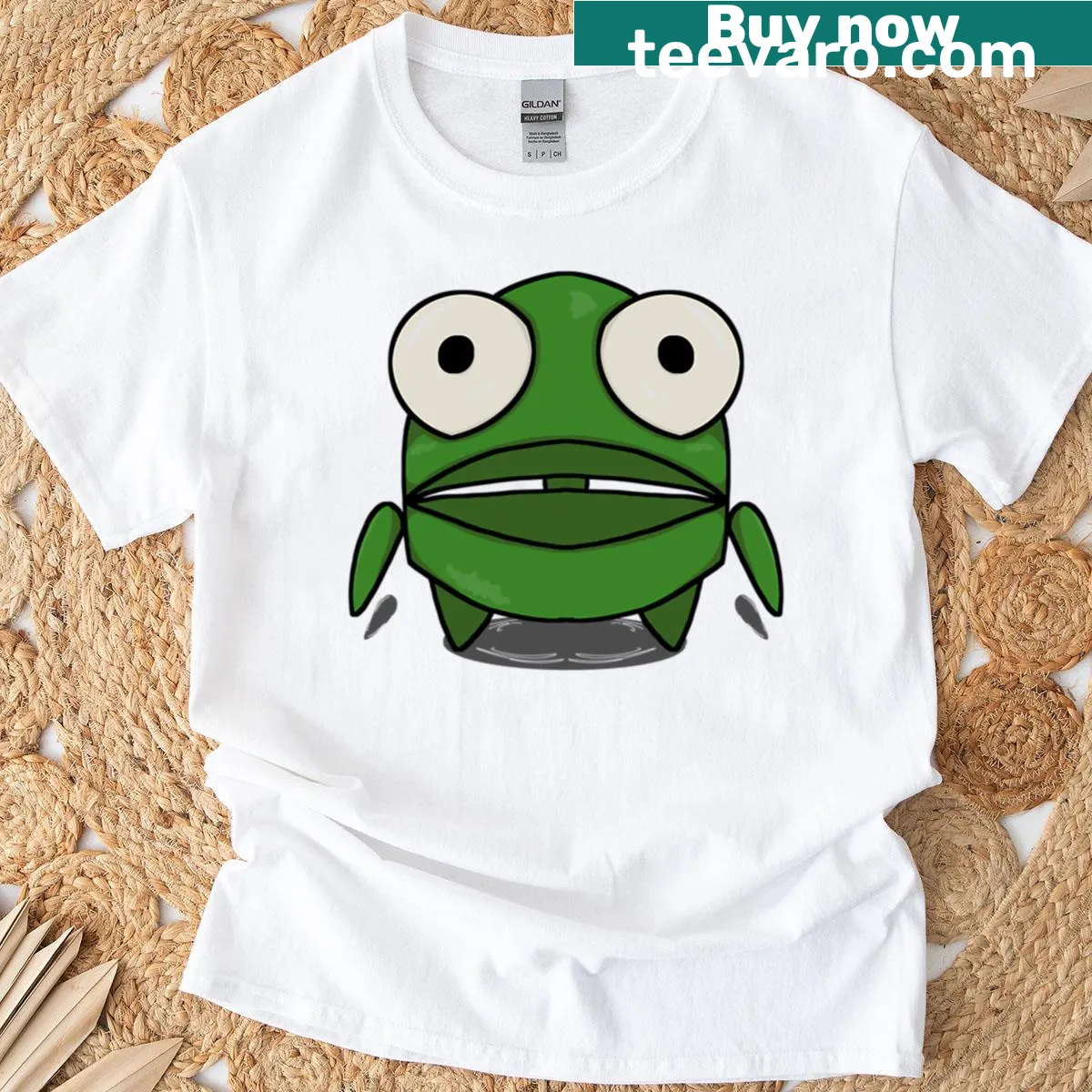 Cartoon T-shirt featuring a tiny green robot with a playful design. — on a men's t-shirt