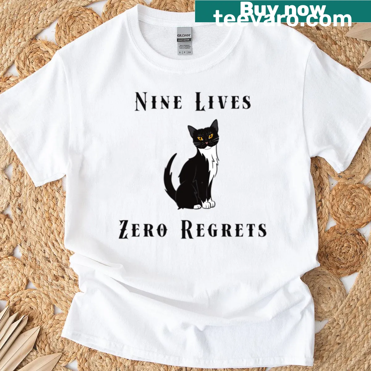 Gothic t-shirt featuring a black cat with the phrase 'Nine Lives Zero Regrets'. — on a men's t-shirt