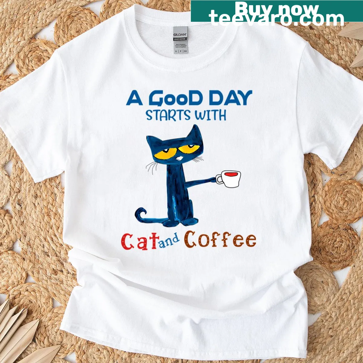 Vintage logo t-shirt featuring cartoon cat, shoes, and books — on a men's t-shirt