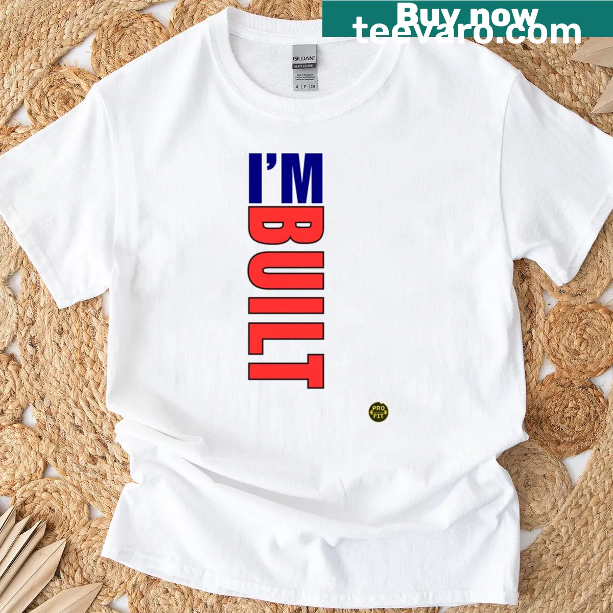 Bold typography stating 'Strength Is Constructed' on a t-shirt — on a men's t-shirt