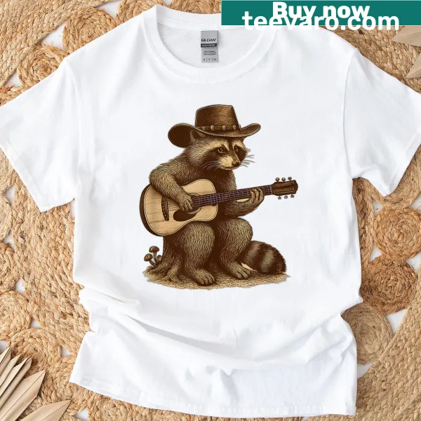 Illustrated T-shirt featuring a raccoon cowboy with a guitar