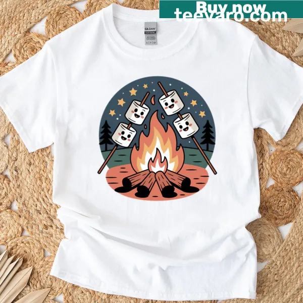 Charming T-shirt featuring an illustration of marshmallows roasting by a campfire.