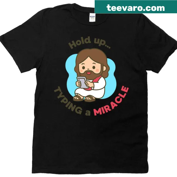 Oversized t-shirt with cartoon of Jesus texting 'Typing A Miracle'