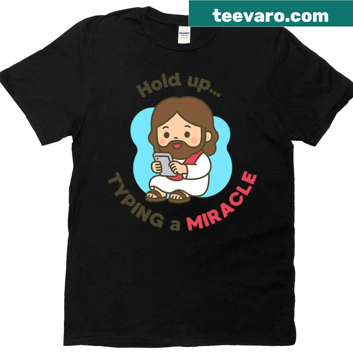 Oversized t-shirt with cartoon of Jesus texting 'Typing A Miracle' — on a men's t-shirt