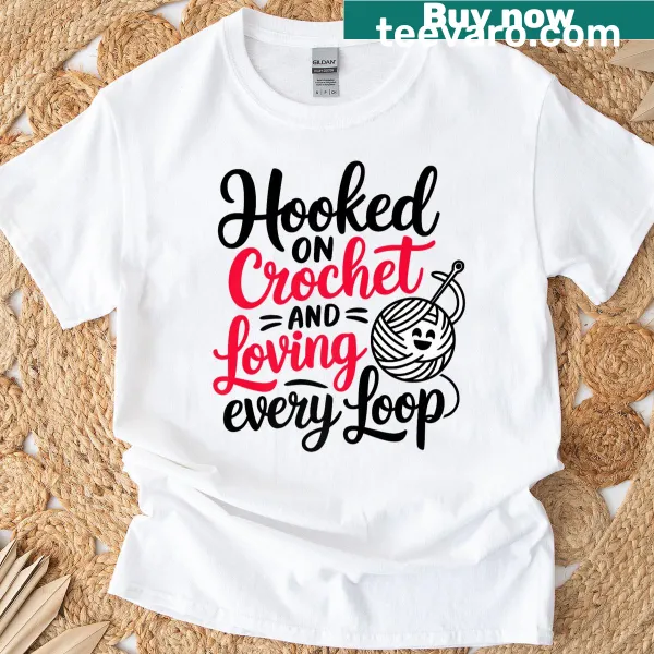 Illustration of crochet hooks and yarn on a T-shirt