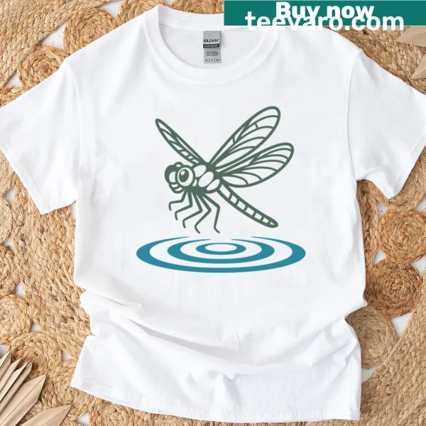 Illustrative t-shirt featuring a dragonfly over water