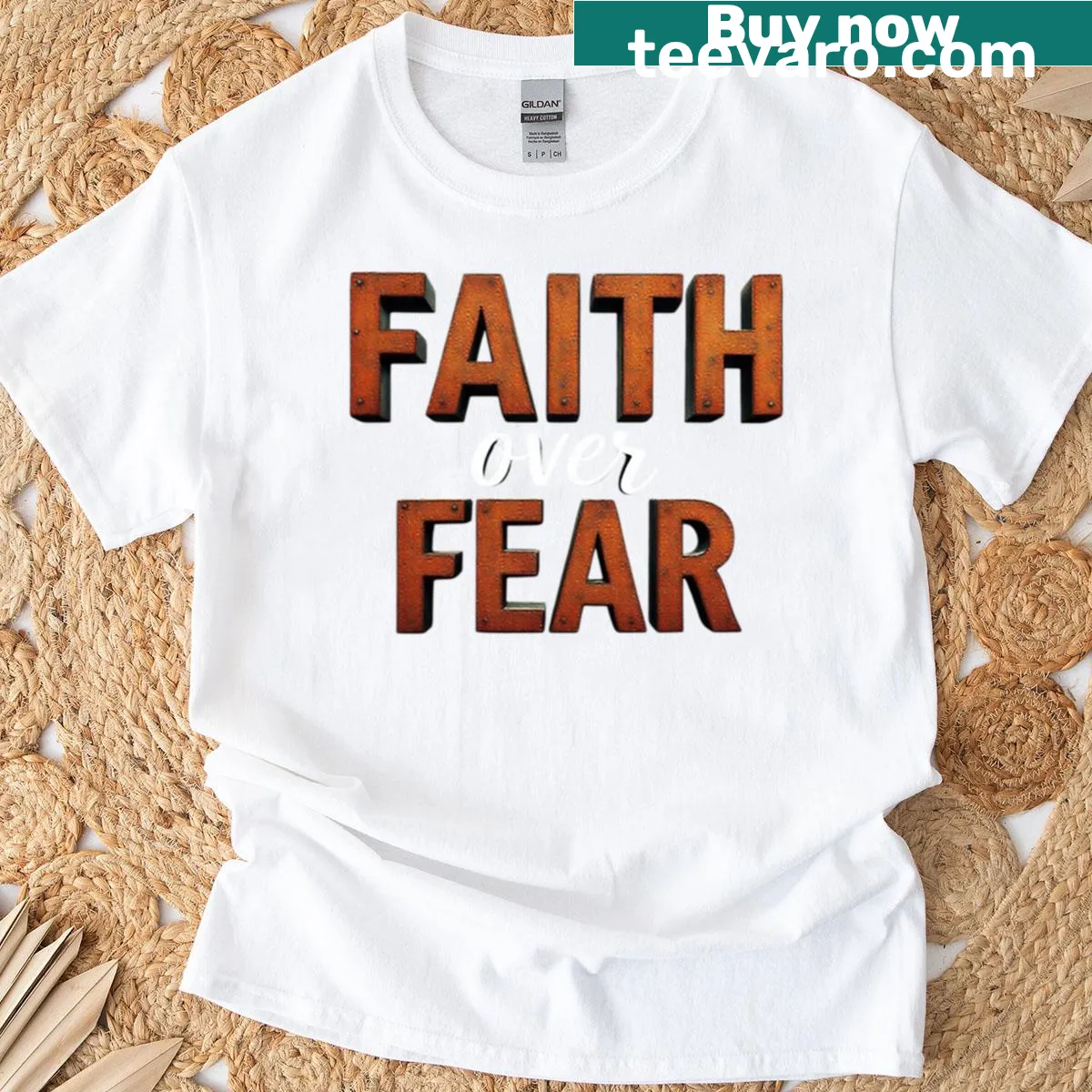 Oversized T-shirt with minimalist typography design reading 'Faith Over Fear'. — on a men's t-shirt