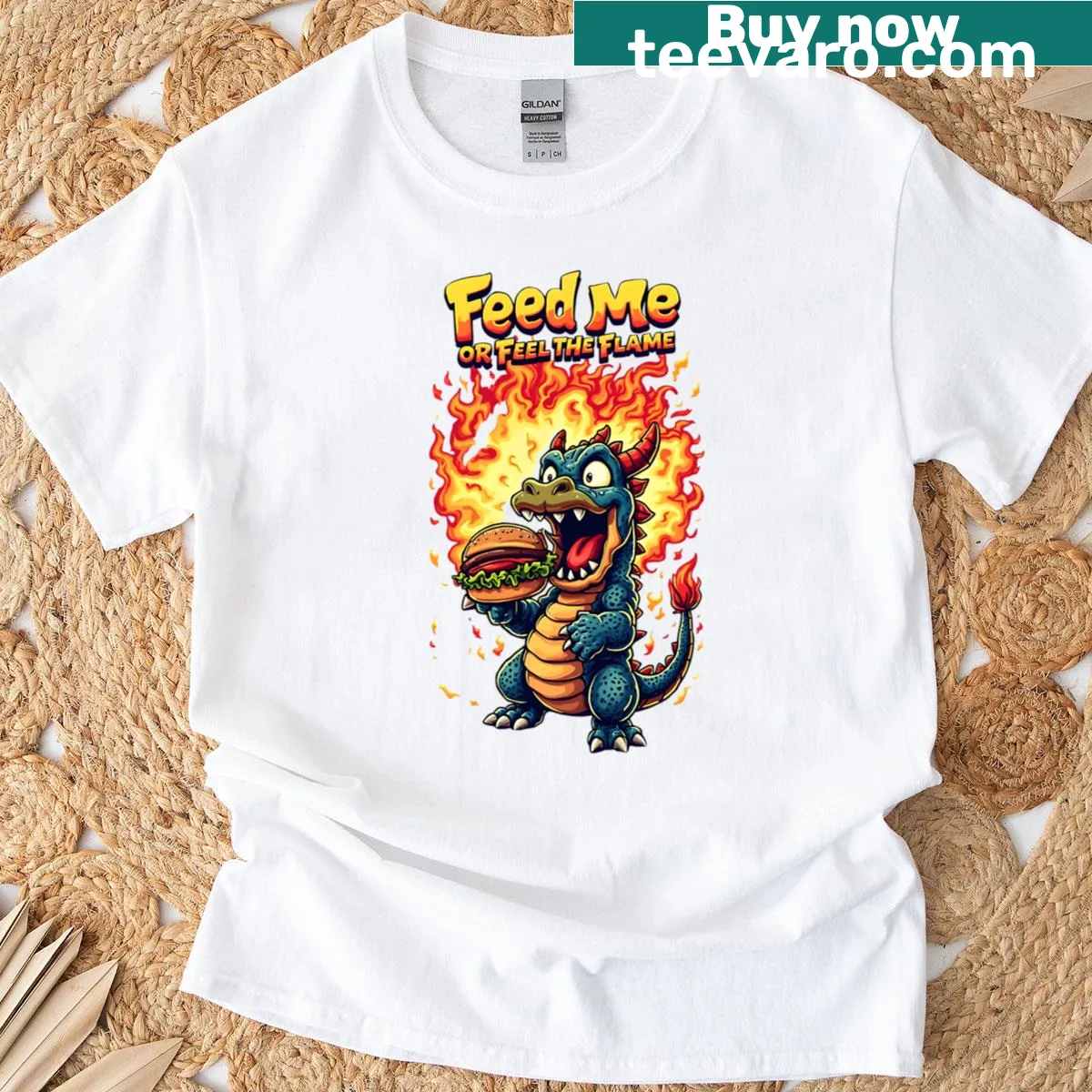 Cartoon-style T-shirt featuring a cute dragon with the text 'Feed Me Or Feel The Flame' — on a men's t-shirt