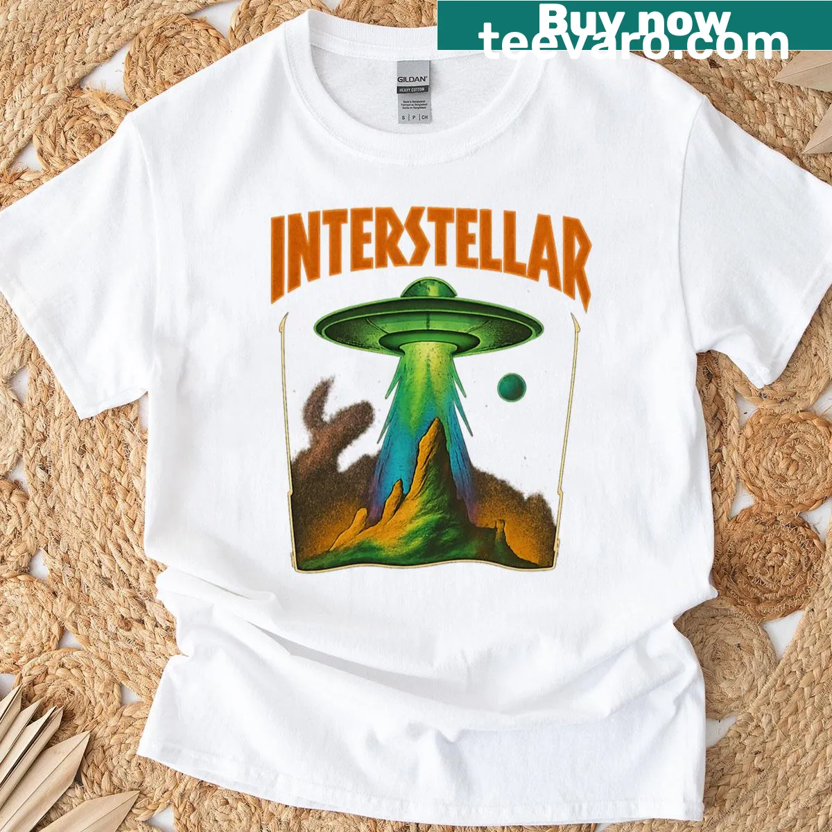 Retro UFO graphic t-shirt featuring an interstellar theme — on a men's t-shirt