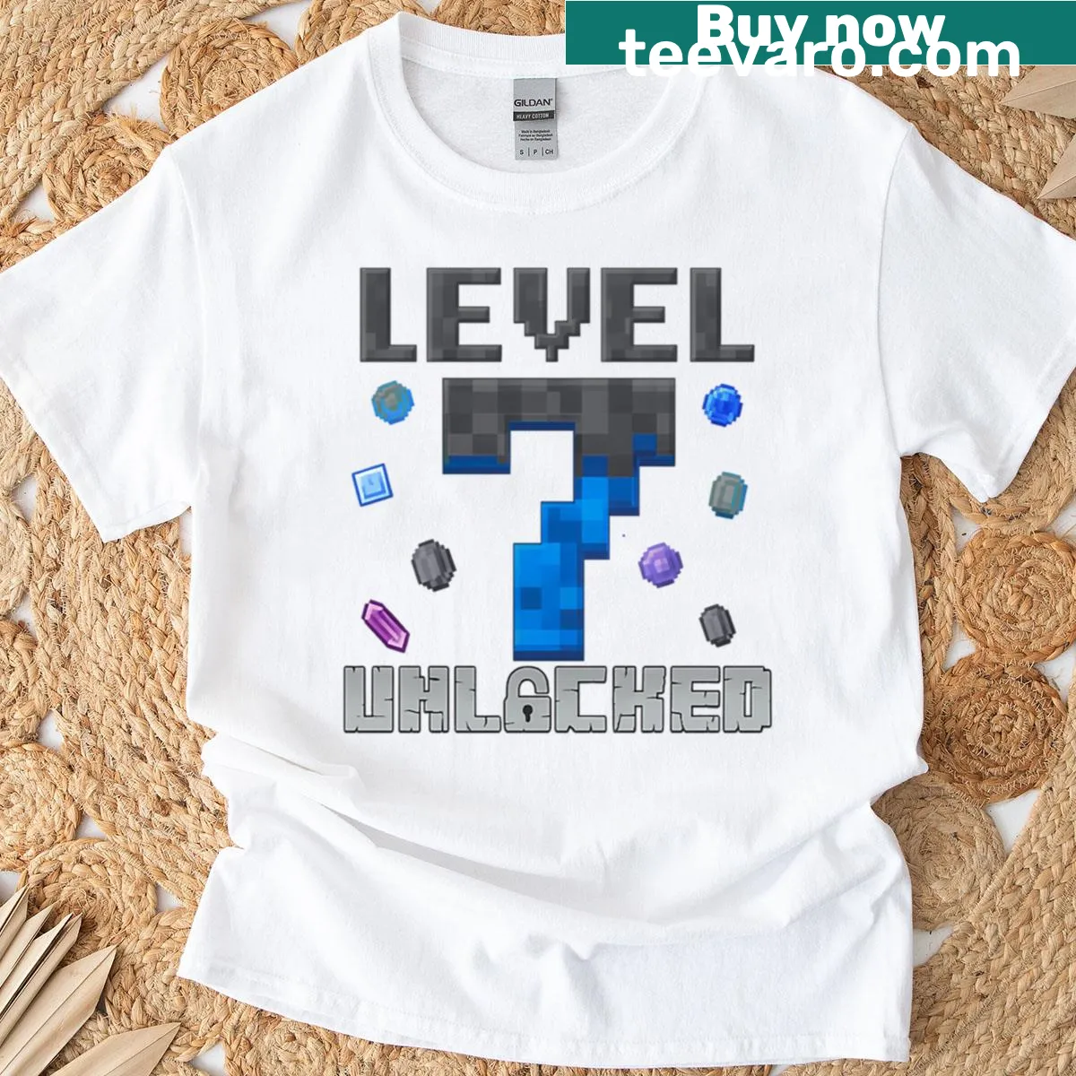 Pixelated Level 7 Unlocked gamer T-shirt with achievement graphic — on a men's t-shirt