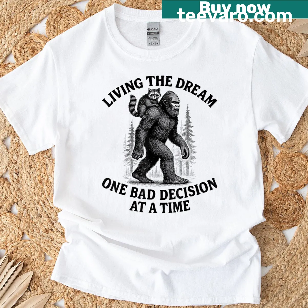 Funny cartoon raccoon and Bigfoot graphic with a humorous saying — on a men's t-shirt