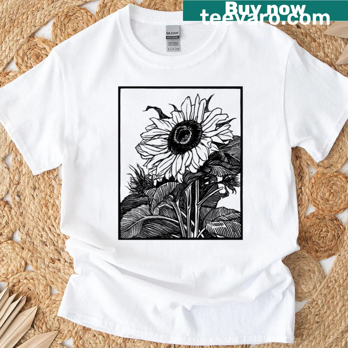Woodcut design of a sunflower in black and white. — on a men's t-shirt