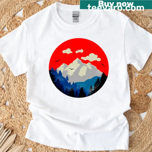 Oversized T-shirt featuring a sunset over mountains