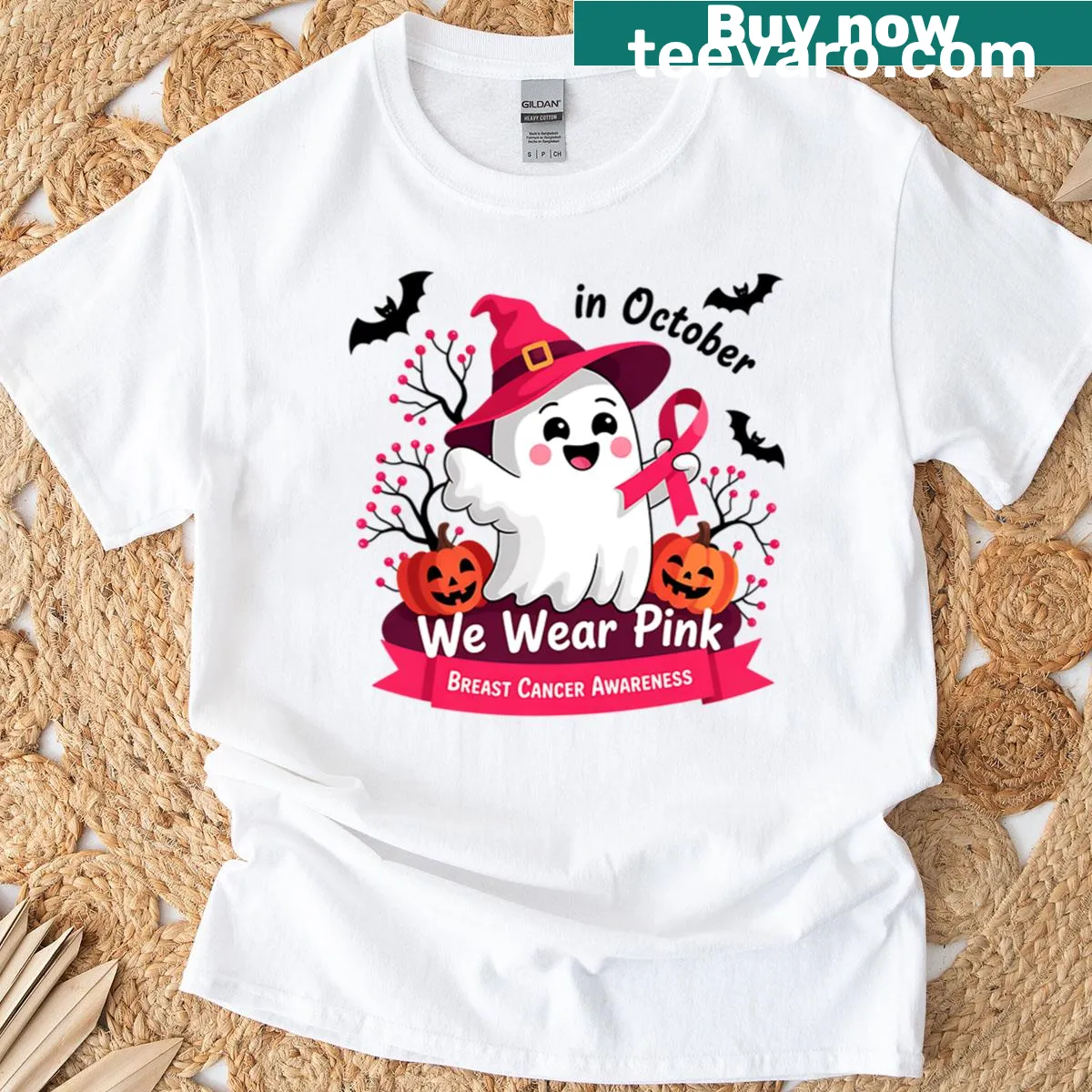 Breast cancer awareness Halloween T-shirt with 'In October We Wear Pink' text — on a men's t-shirt