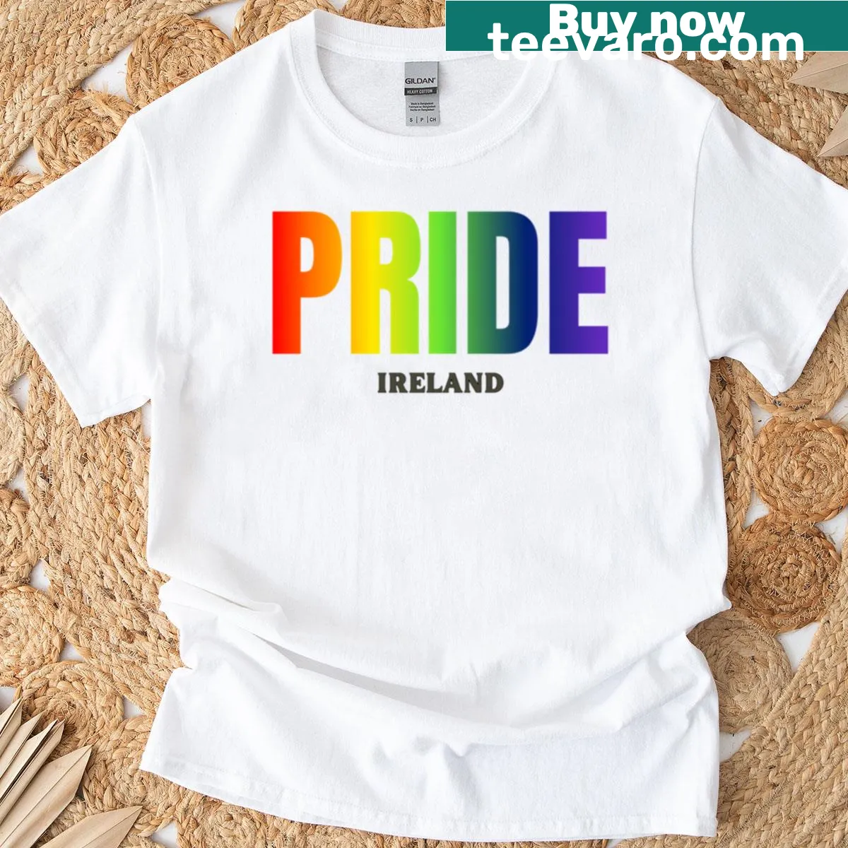 Rainbow graphic T-shirt celebrating LGBTQ+ pride with Irish cultural elements. — on a men's t-shirt