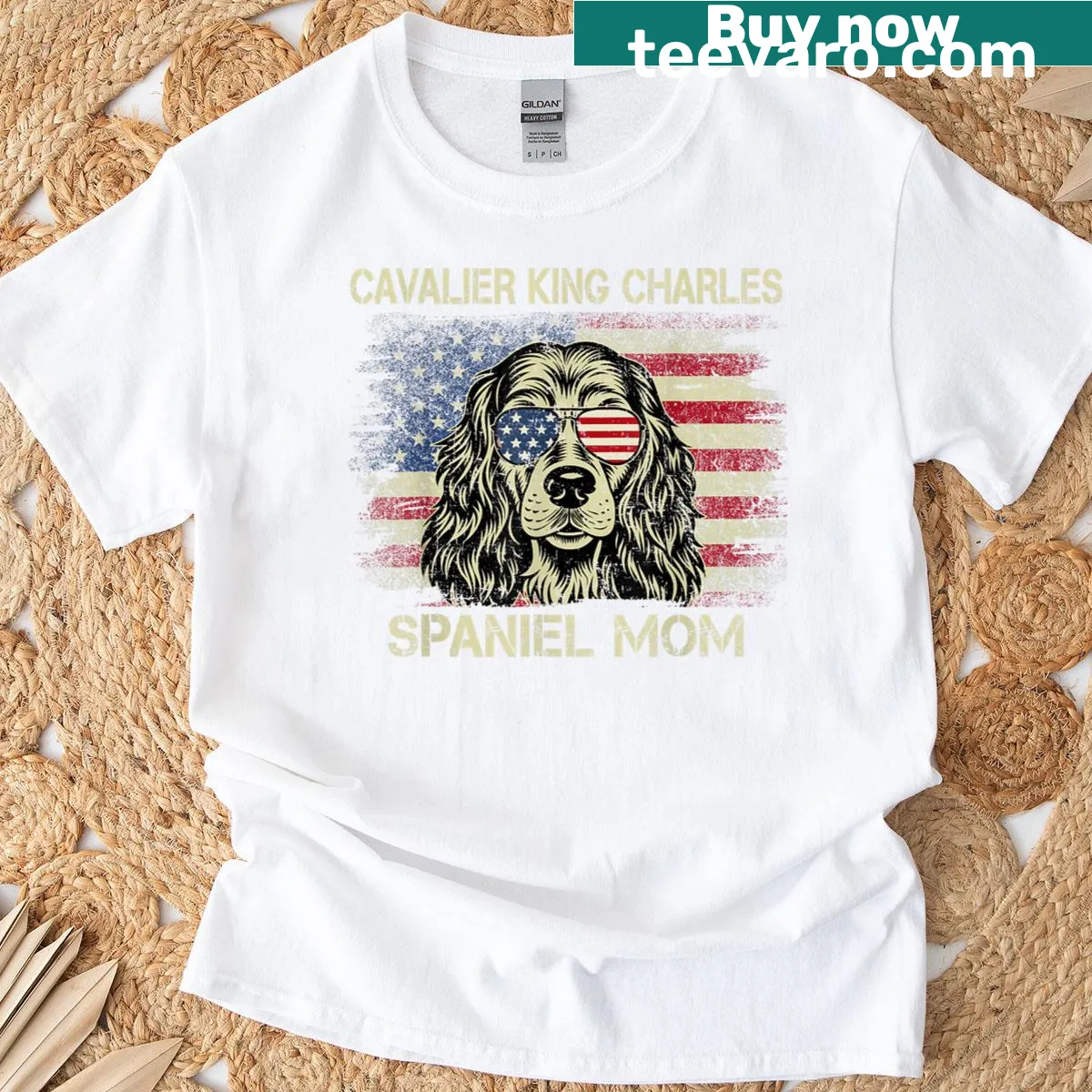 T-shirt showcasing a Cavalier King Charles Spaniel with an American flag for July 4th. — on a men's t-shirt
