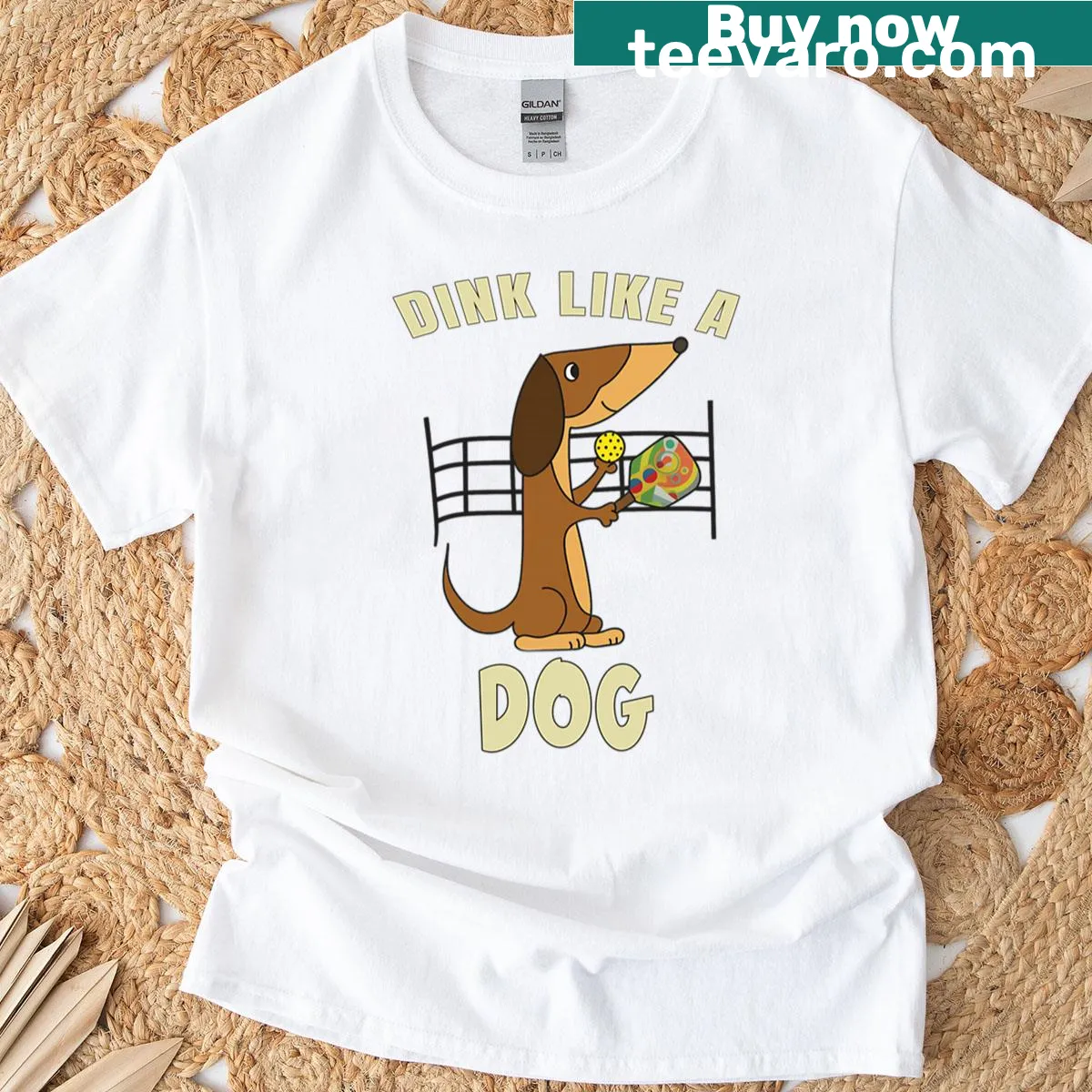 Funny cartoon T-shirt featuring a dog with a paddle playing pickleball — on a men's t-shirt