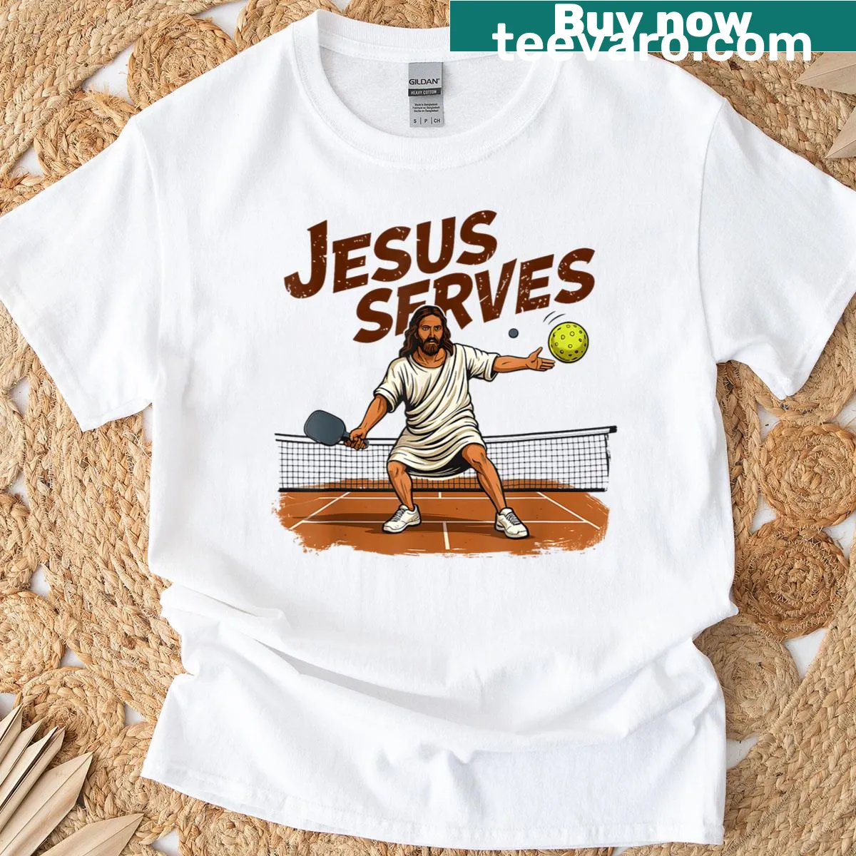 Illustrative t-shirt featuring Jesus serving a pickleball — on a men's t-shirt