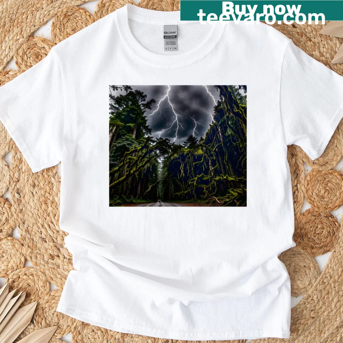 T-shirt depicting a dramatic lightning storm over a mossy forest road — on a men's t-shirt