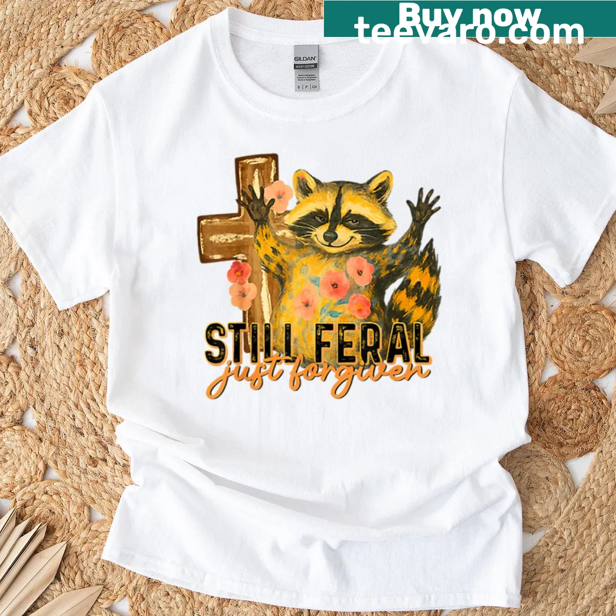 Vintage distressed t-shirt with raccoon and Christian cross graphics — on a men's t-shirt