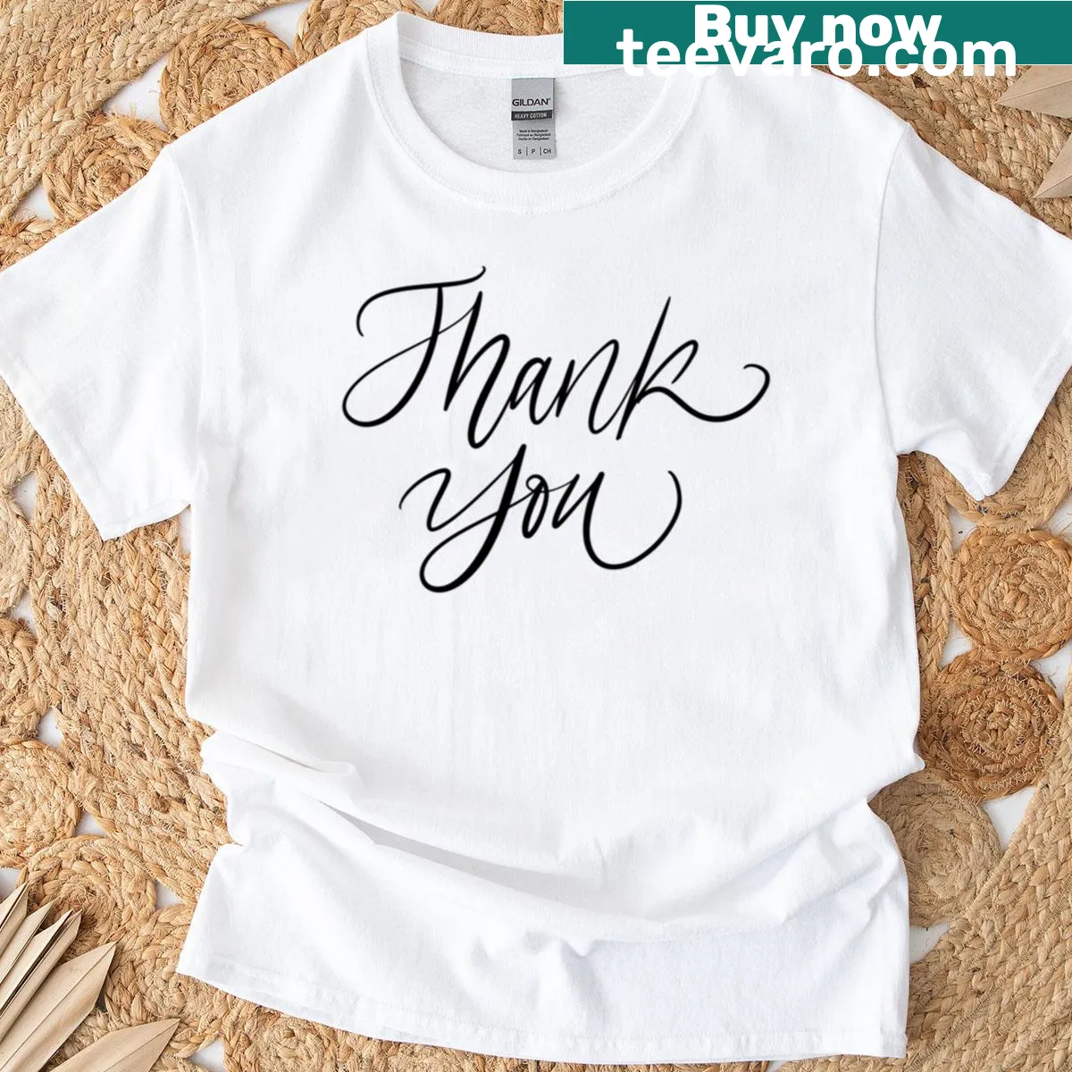 Minimalist T-shirt with a 'Thank You' design on a black tile background — on a men's t-shirt