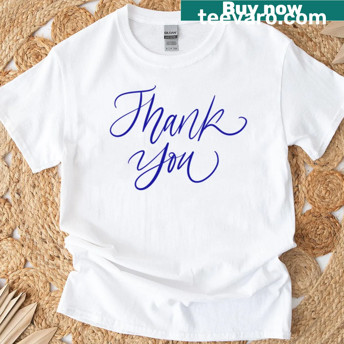 Minimalist T-shirt featuring a 'Thank You' graphic on a blue tile background — on a men's t-shirt