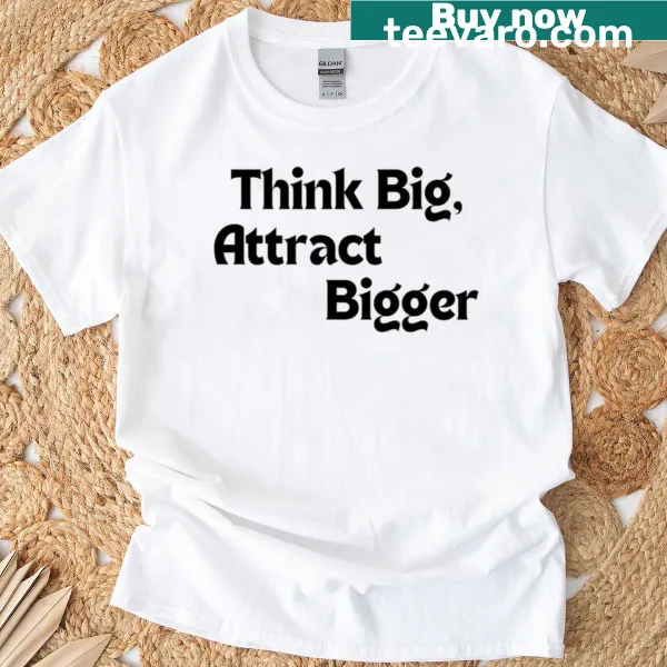 Motivational T-shirt with the phrase 'Think Big Attract Bigger' in bold typography.