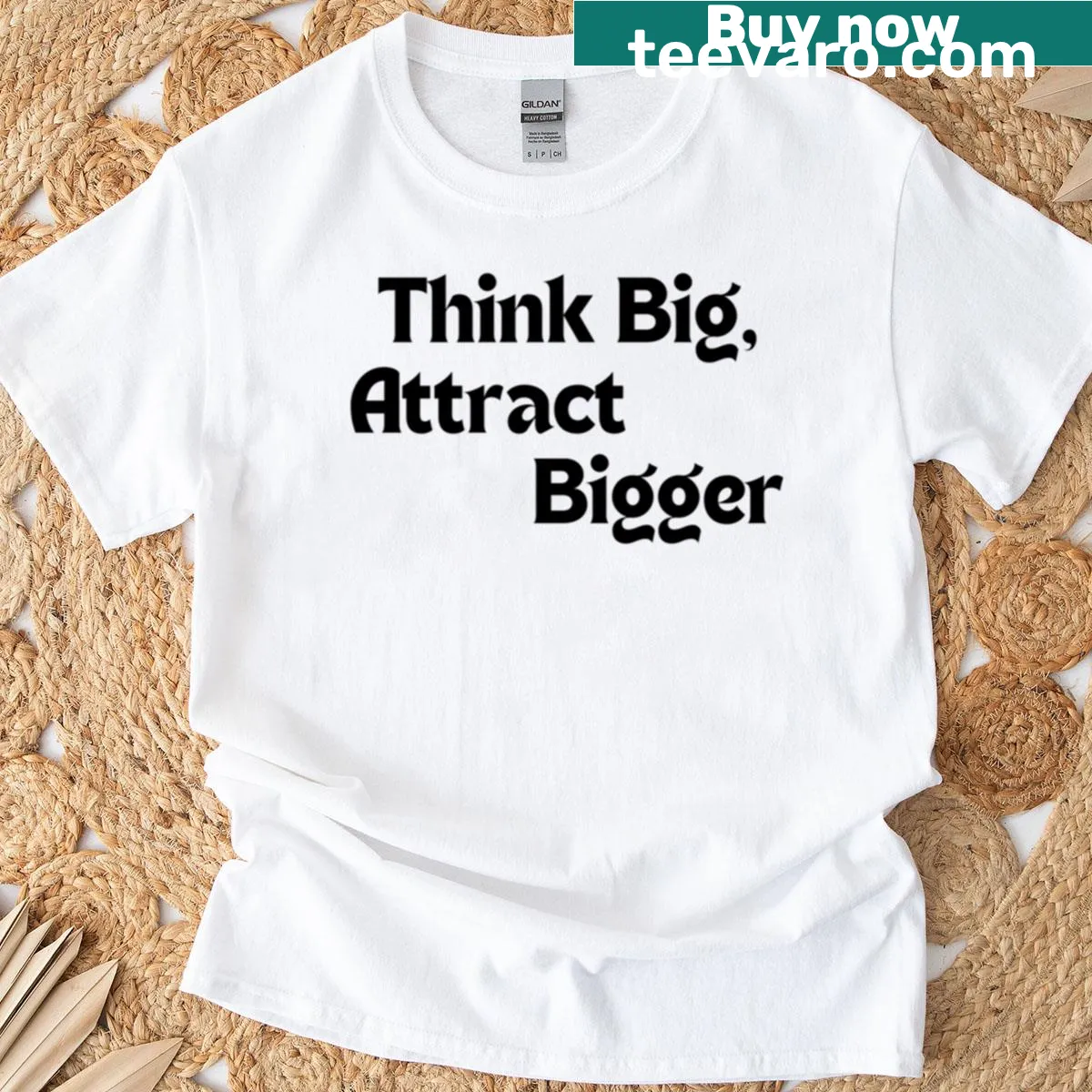 Motivational T-shirt with the phrase 'Think Big Attract Bigger' in bold typography. — on a men's t-shirt