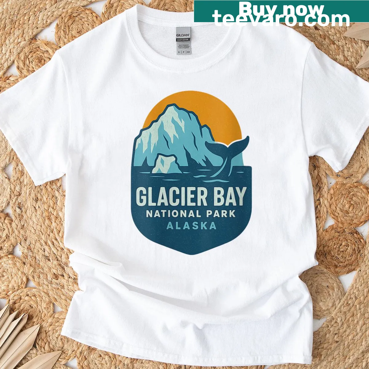 Scenic T-shirt featuring a whale and Glacier National Park illustration — on a men's t-shirt