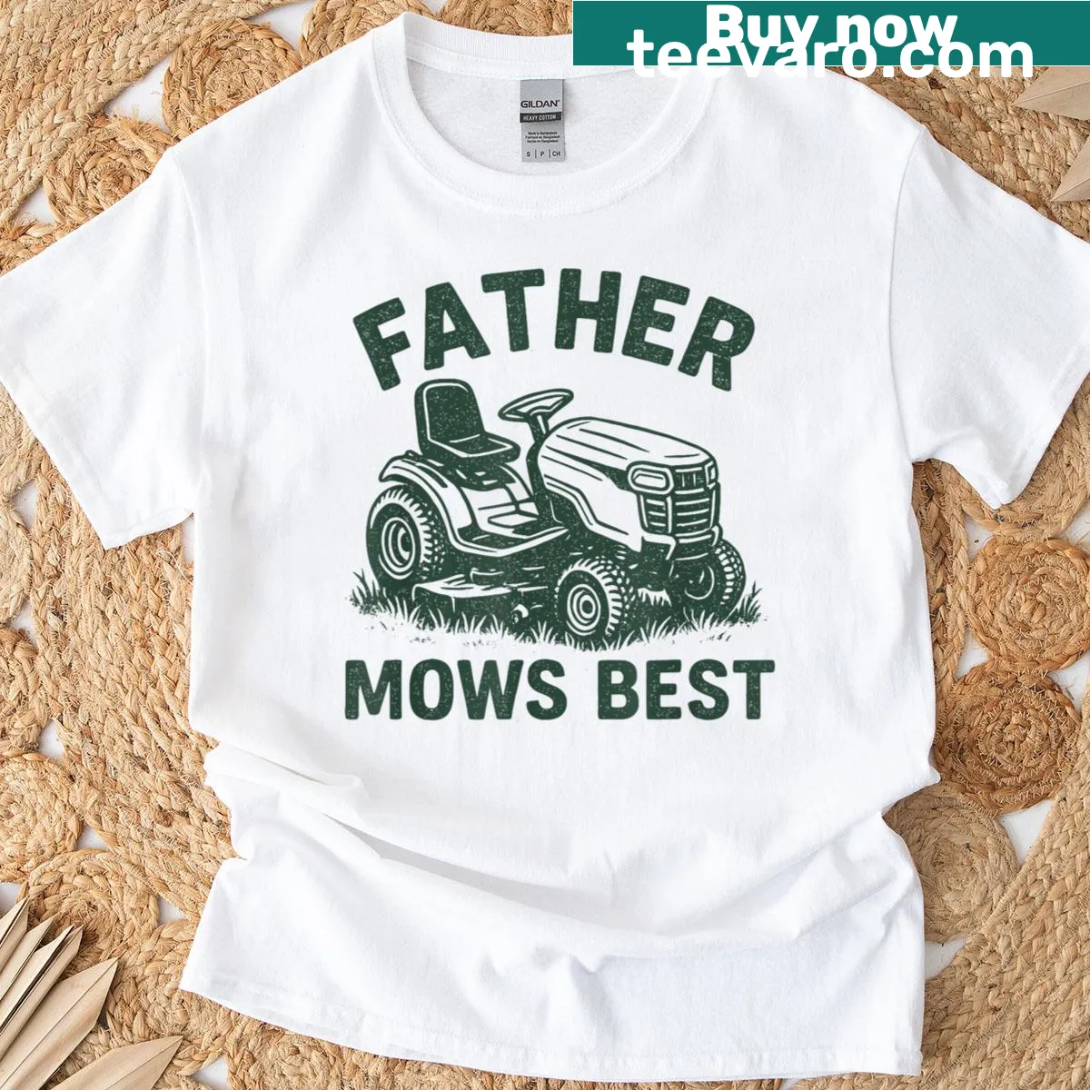 Retro-style t-shirt that says 'Father Mows Best' with playful graphics — on a men's t-shirt