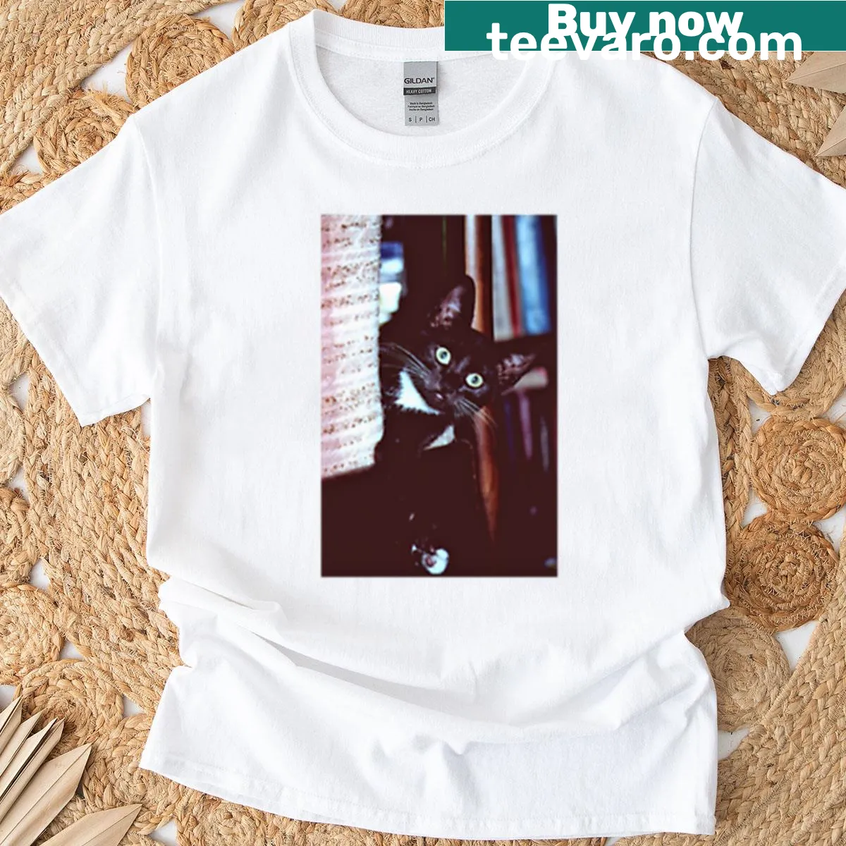T-shirt with an adorable small black cat graphic — on a men's t-shirt