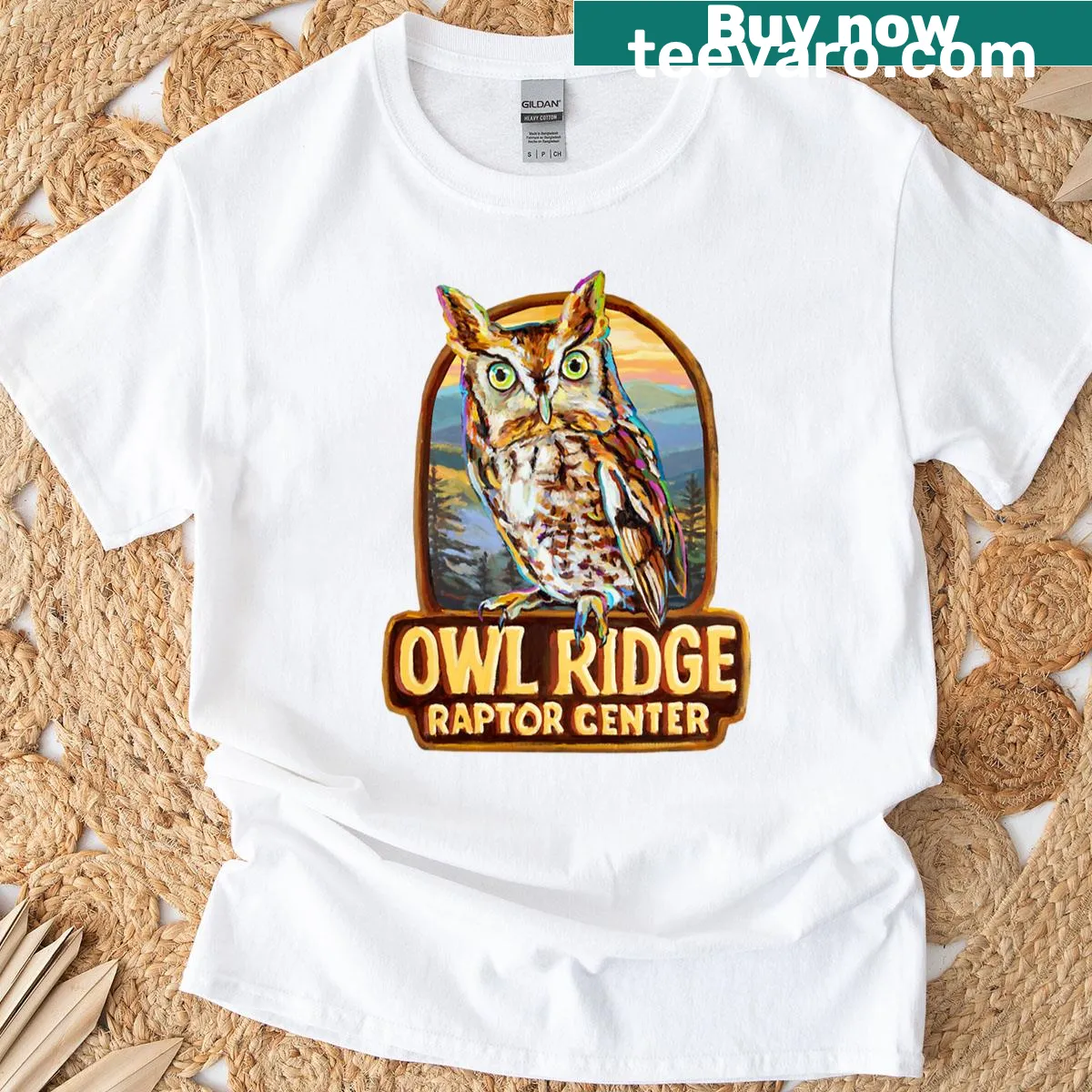 Charming eastern screech owl illustration on a T-shirt from Owl Ridge Raptor Center — on a men's t-shirt