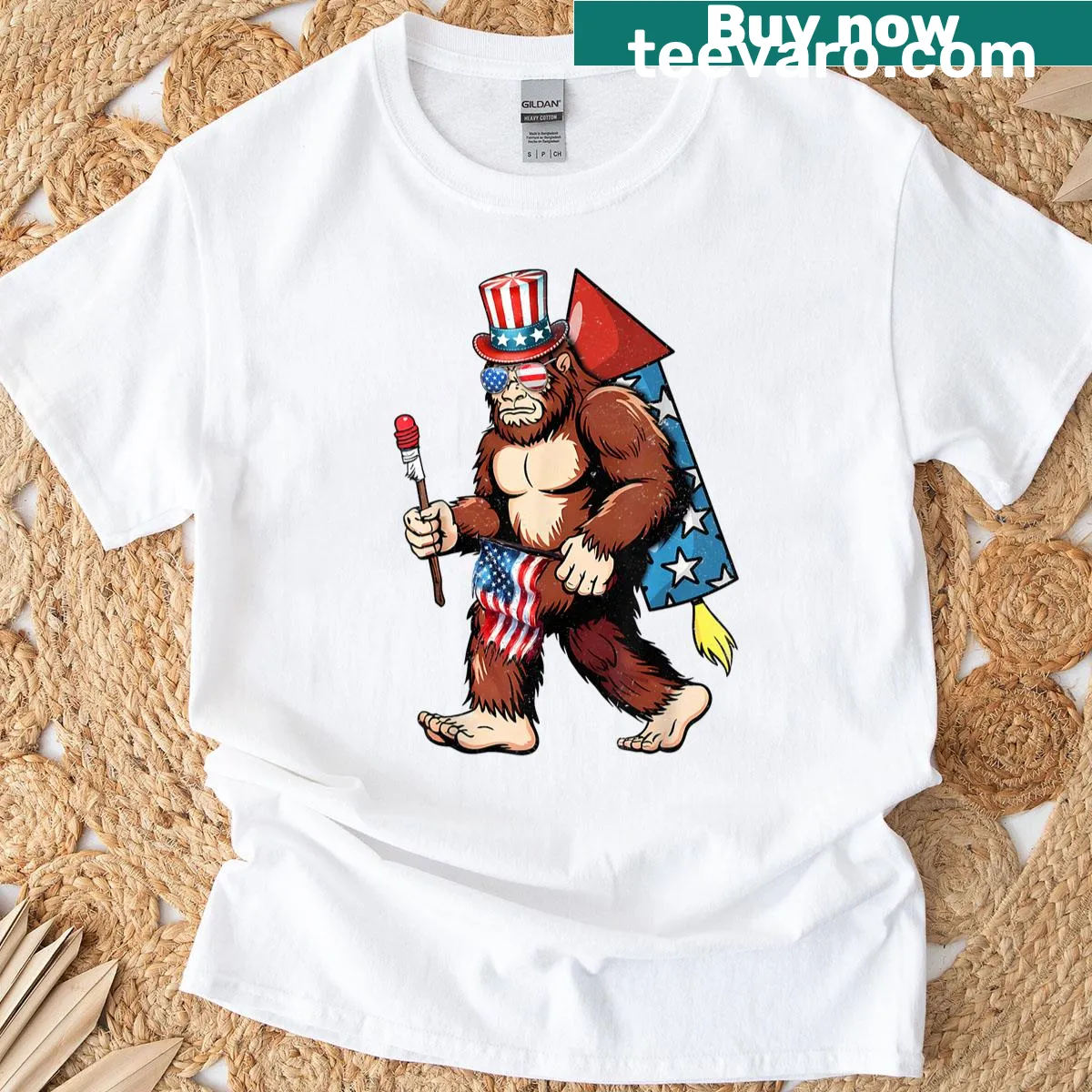 T-shirt featuring Bigfoot with American flag and fireworks illustration — on a men's t-shirt