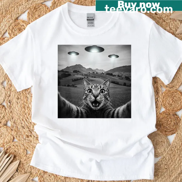 Funny cat selfie with alien UFO graphic on a t-shirt