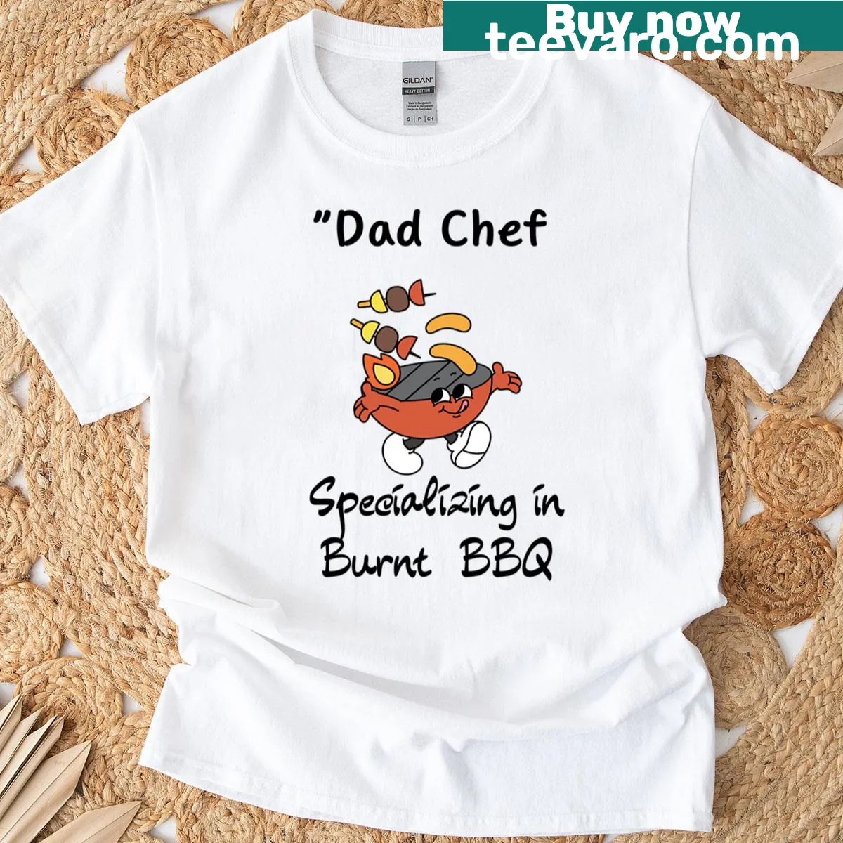 Funny Chef Dad T-shirt with 'specializing in burnt BBQ' text — on a men's t-shirt