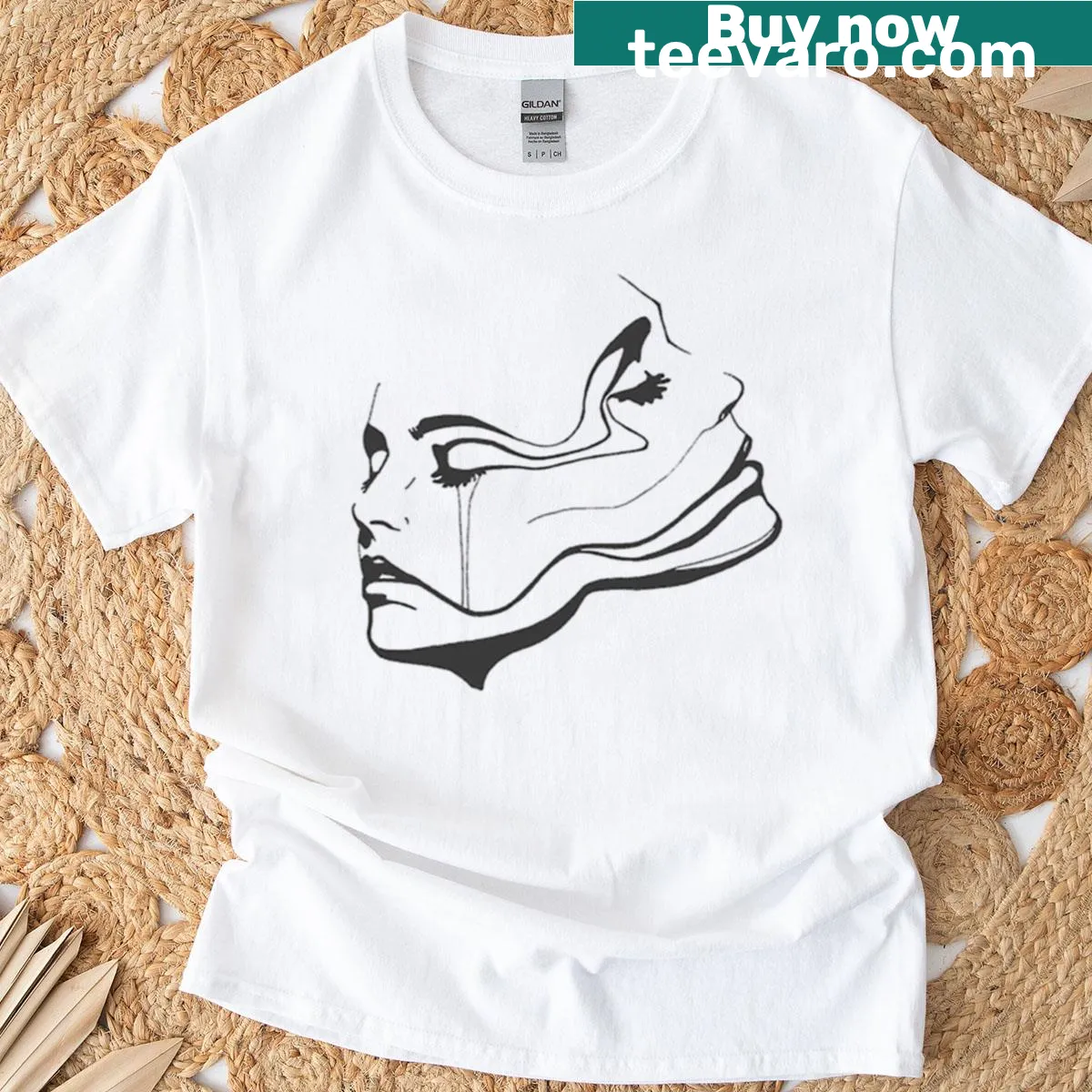 Surreal abstract face graphic t-shirt — on a men's t-shirt