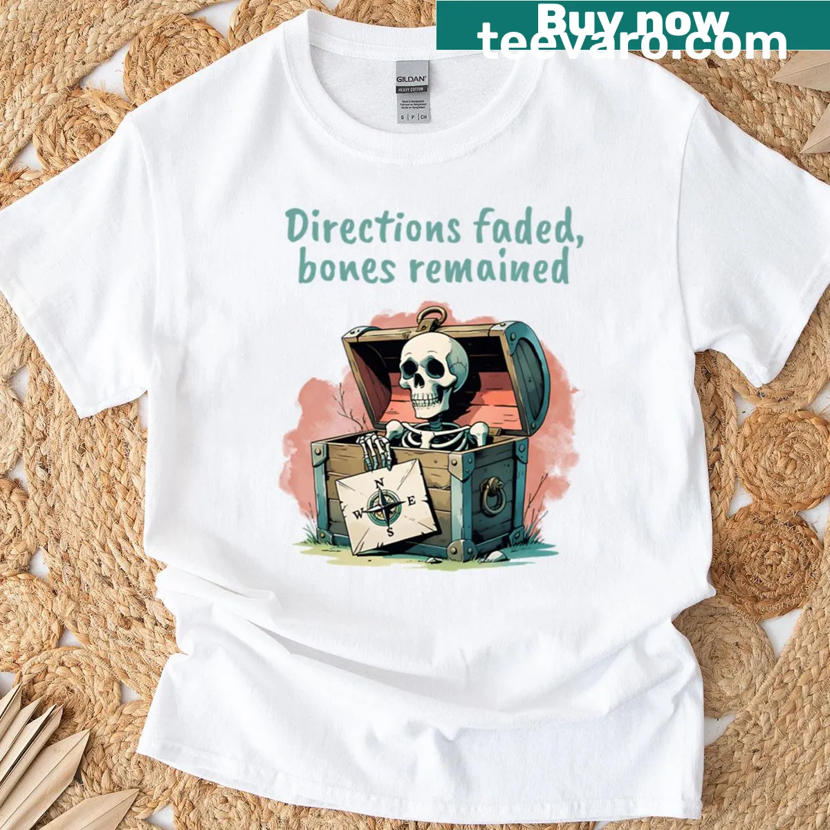 Artistic illustration of a skull in a chest with a compass map on a t-shirt — on a men's t-shirt