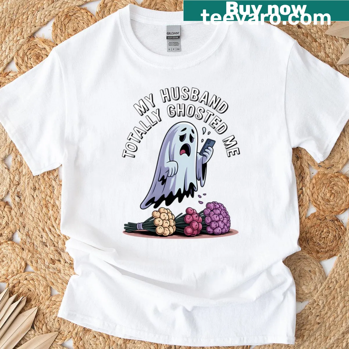 Oversized Halloween t-shirt with a sad ghost graphic and distressed design. — on a men's t-shirt