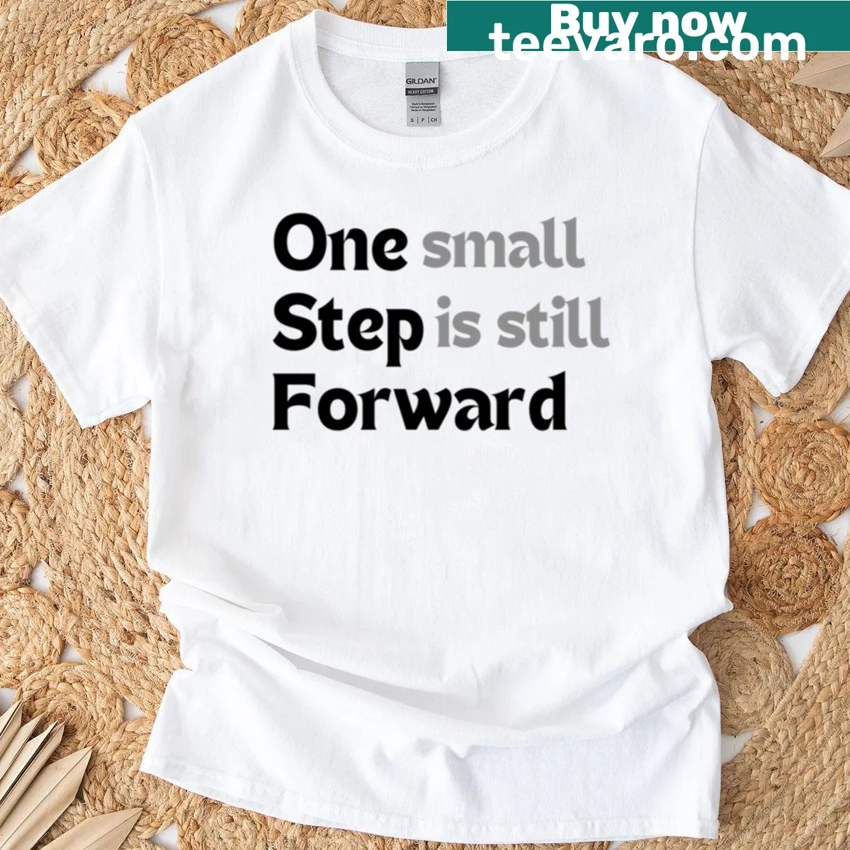 Minimalist t-shirt with the motivational quote One Small Step Is Still Forward — on a men's t-shirt