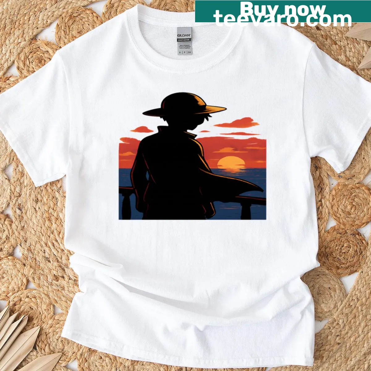 Anime t-shirt featuring a silhouette of a straw hat pirate at sunset — on a men's t-shirt