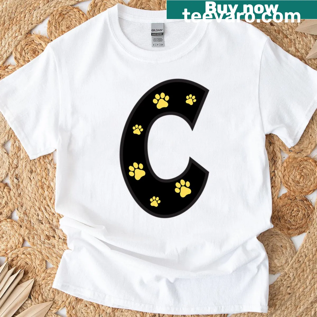 Cute alphabet t-shirt made of illustrated paw prints — on a men's t-shirt