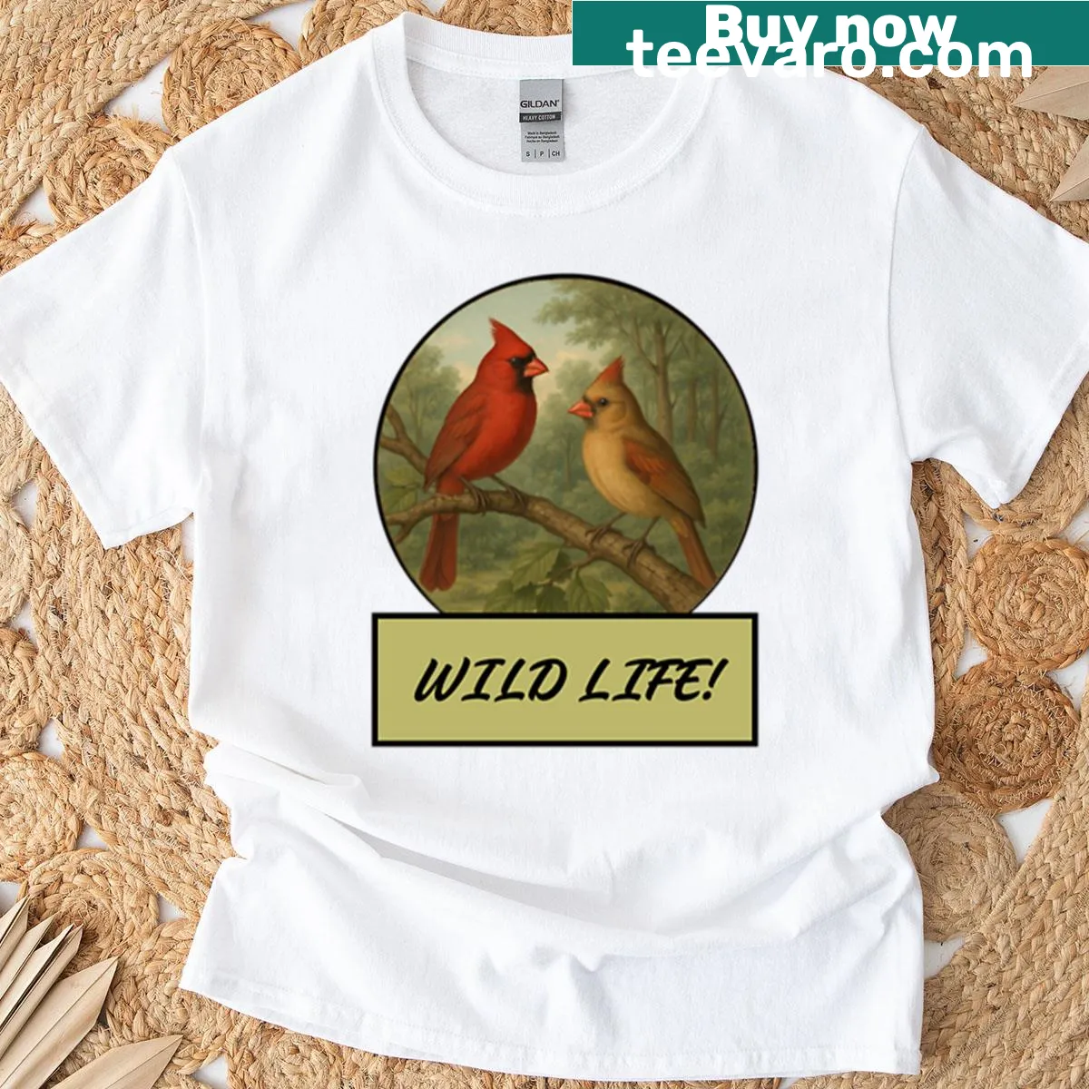 Illustrative T-shirt featuring cardinals in a serene natural setting — on a men's t-shirt