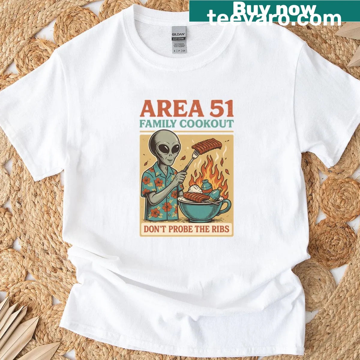 Playful oversized T-shirt depicting cookout with humorous alien theme — on a men's t-shirt
