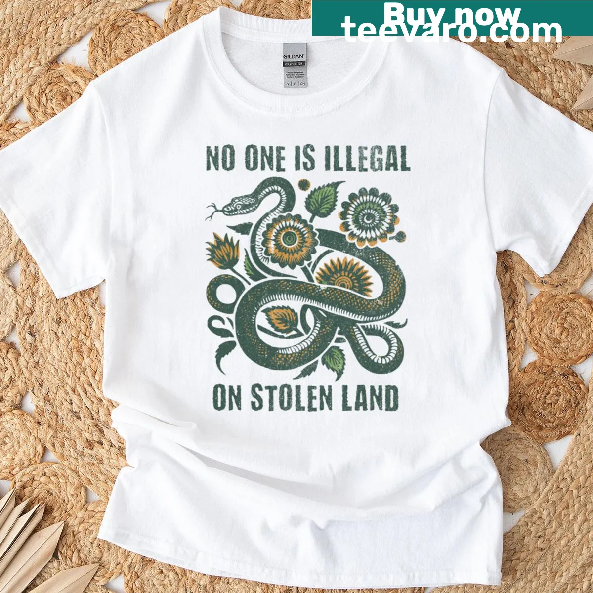 T-shirt with bold text advocating for immigrant rights and social justice — on a men's t-shirt