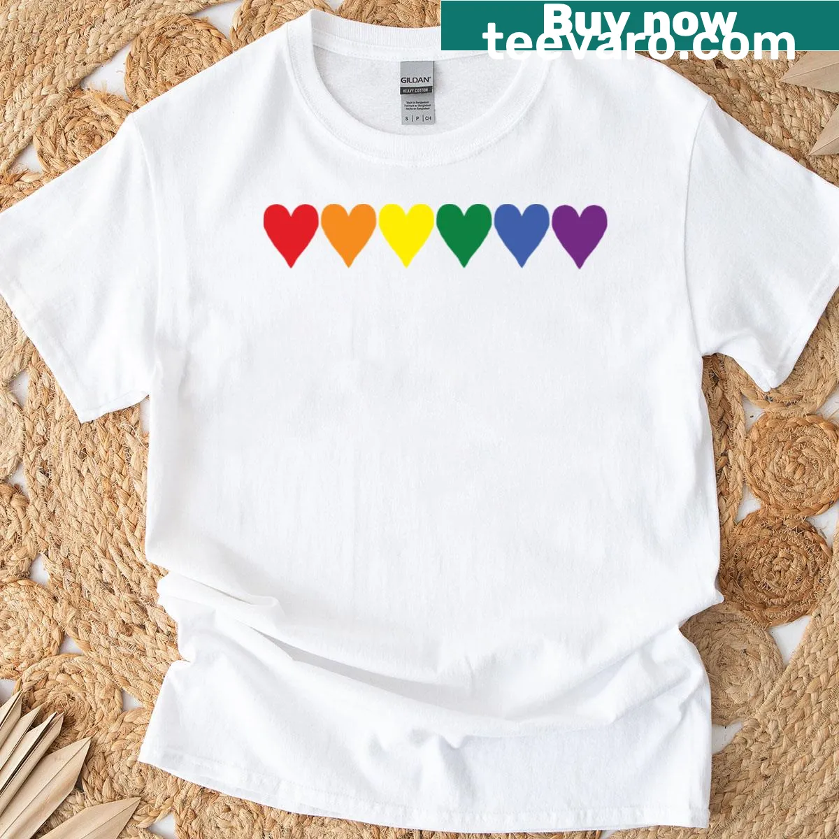 T-shirt featuring small pride hearts graphic — on a men's t-shirt