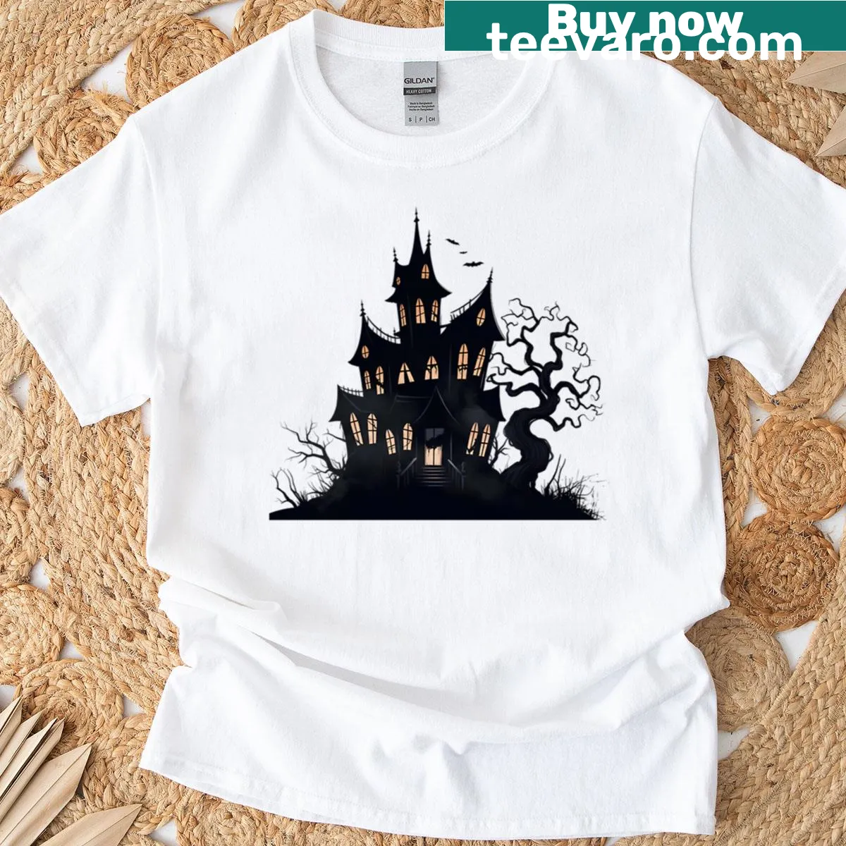 Haunted house surrounded by bats and a tree Halloween T-shirt — on a men's t-shirt