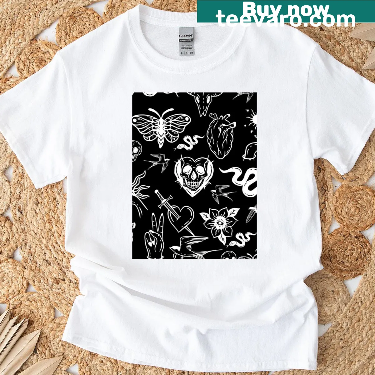 Black T-shirt with a tattoo-inspired illustration of a heart, snake, moth, and dagger — on a men's t-shirt