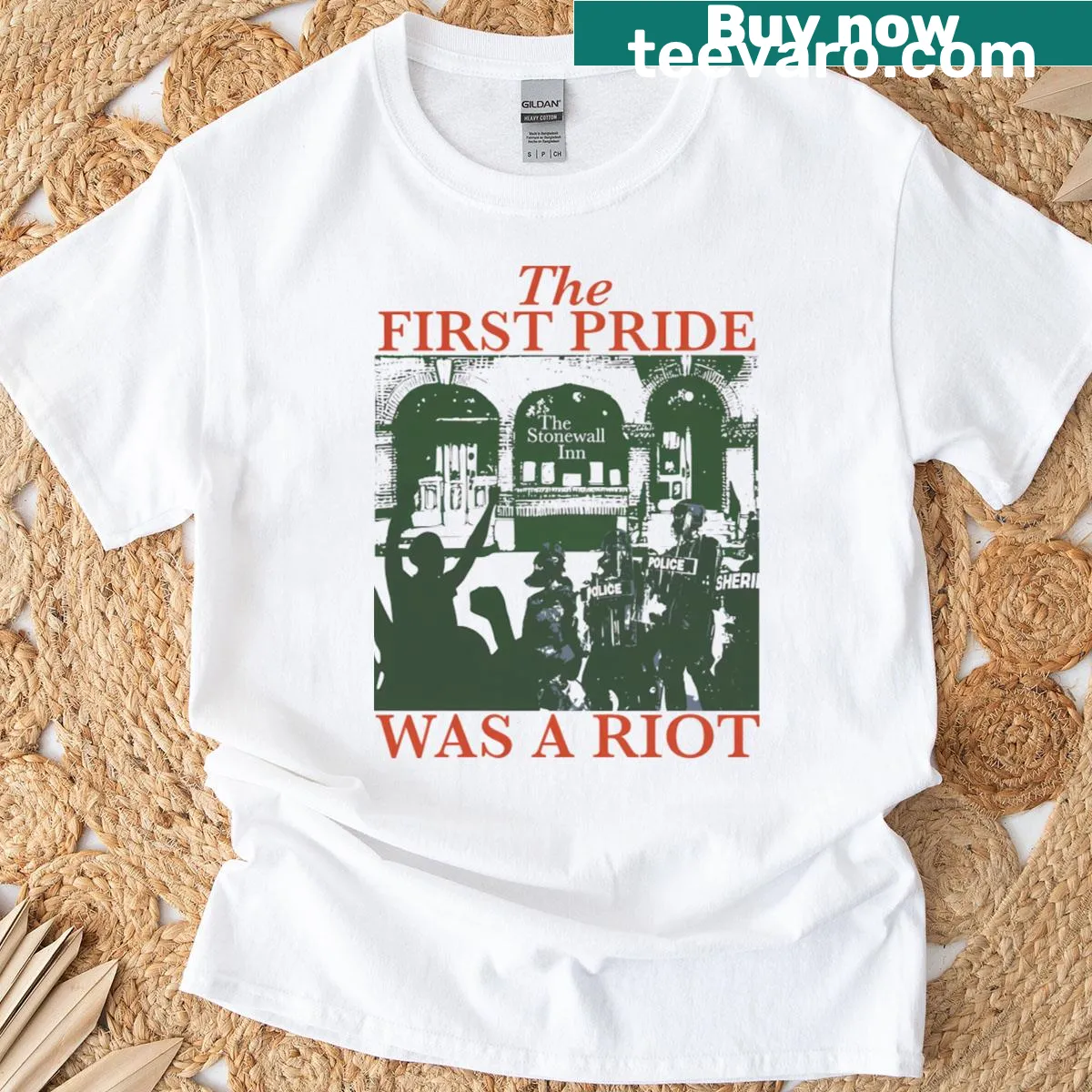 Bold t-shirt with 'The First Pride Was A Riot' text — on a men's t-shirt